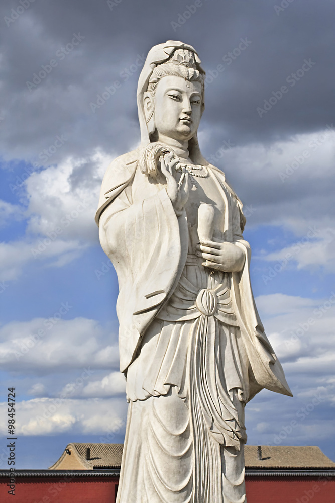 White Sculpture of Guanying Pusa, the bodhisattva associated with compassion as venerated by East Asian Buddhists.