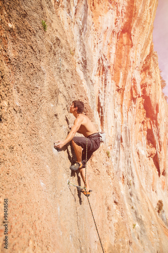 Male rock climber on the wall