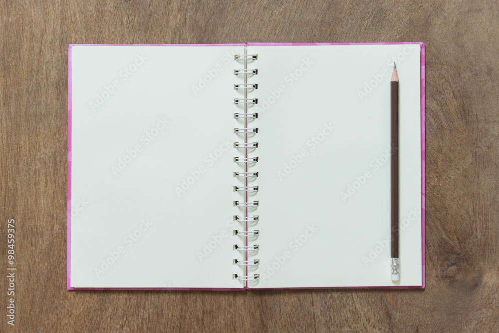 open notebook and pencil on wooden background open notebook and pencil on wooden background