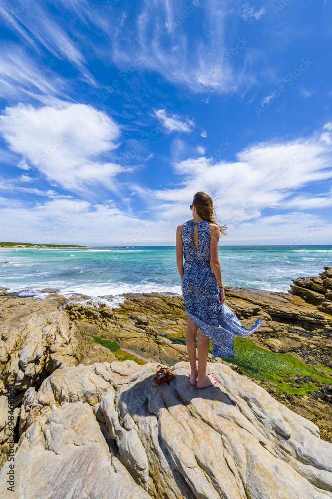 Woman looking at ocean view on summer vacation
