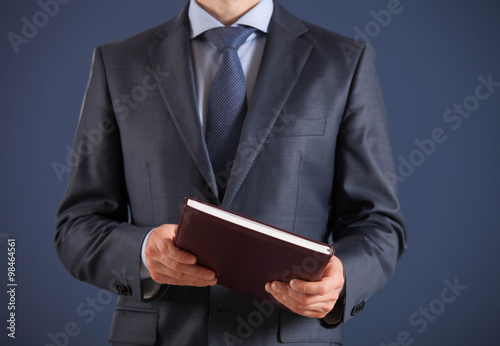Businessman holding a book