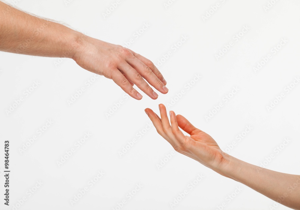 Hands of man and woman reaching out to each other