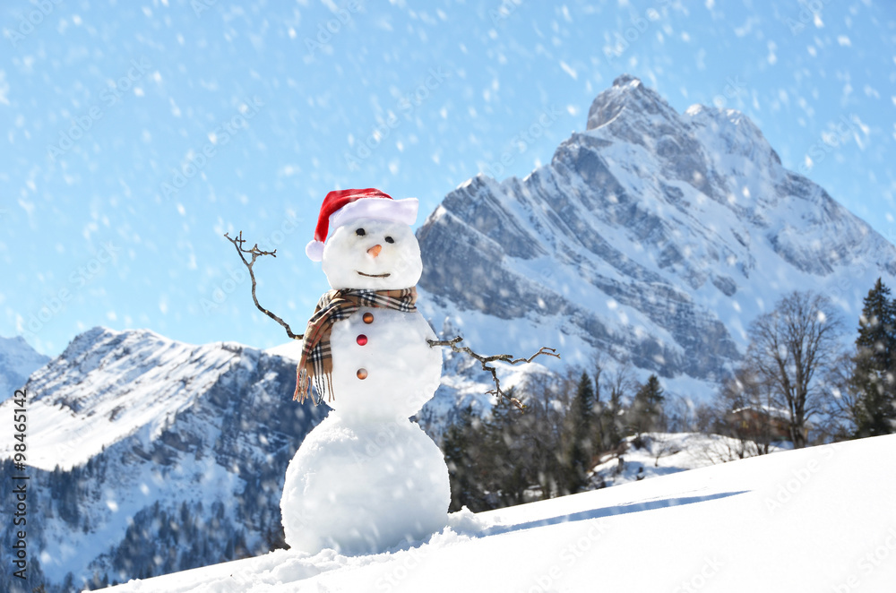 Obraz premium Snowman against Alpine panorama