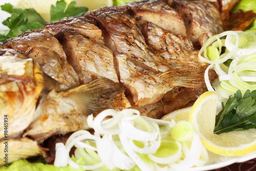 Roasted carp fish with vege...