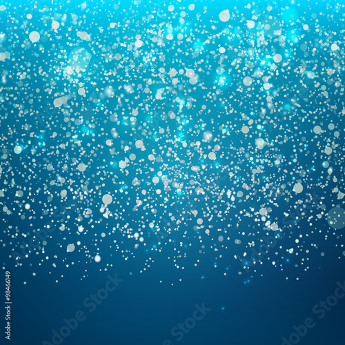 Falling snow on cold sky background