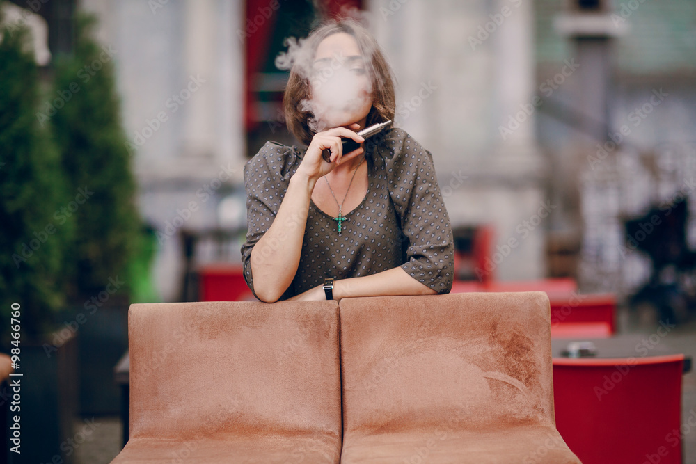 Fototapeta premium girl with E-cigarette