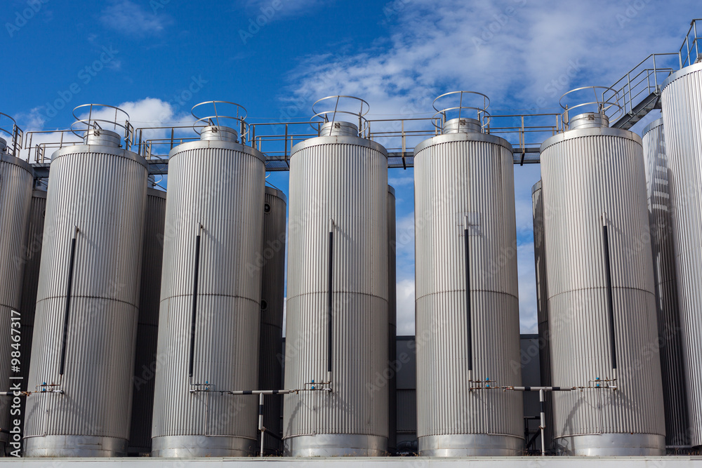 Giant industrial tanks on the bright blue sky Giant industrial tanks on the bright blue sky