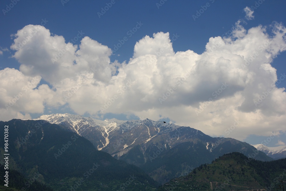 Blue sky with clouds background in mountains. Himalai, India