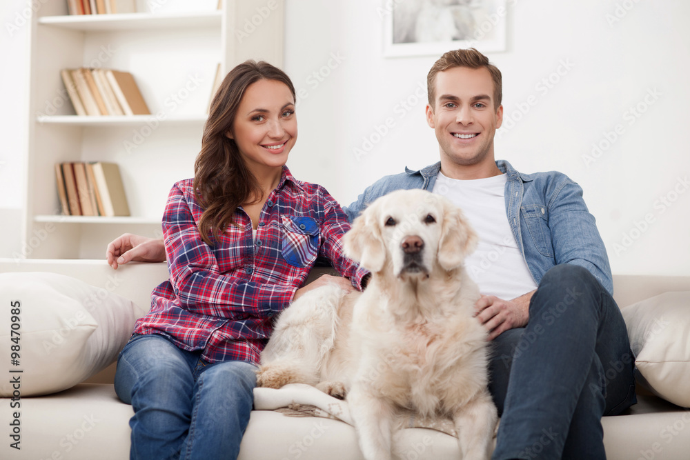 Portrait of cheerful friendly family with pretty big pet Portrait of cheerful friendly family with pretty big pet