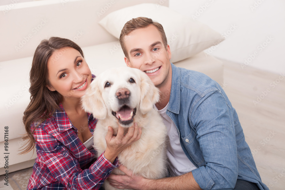 Attractive young married couple with cute pet