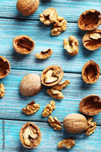 Walnuts on a blue wooden table