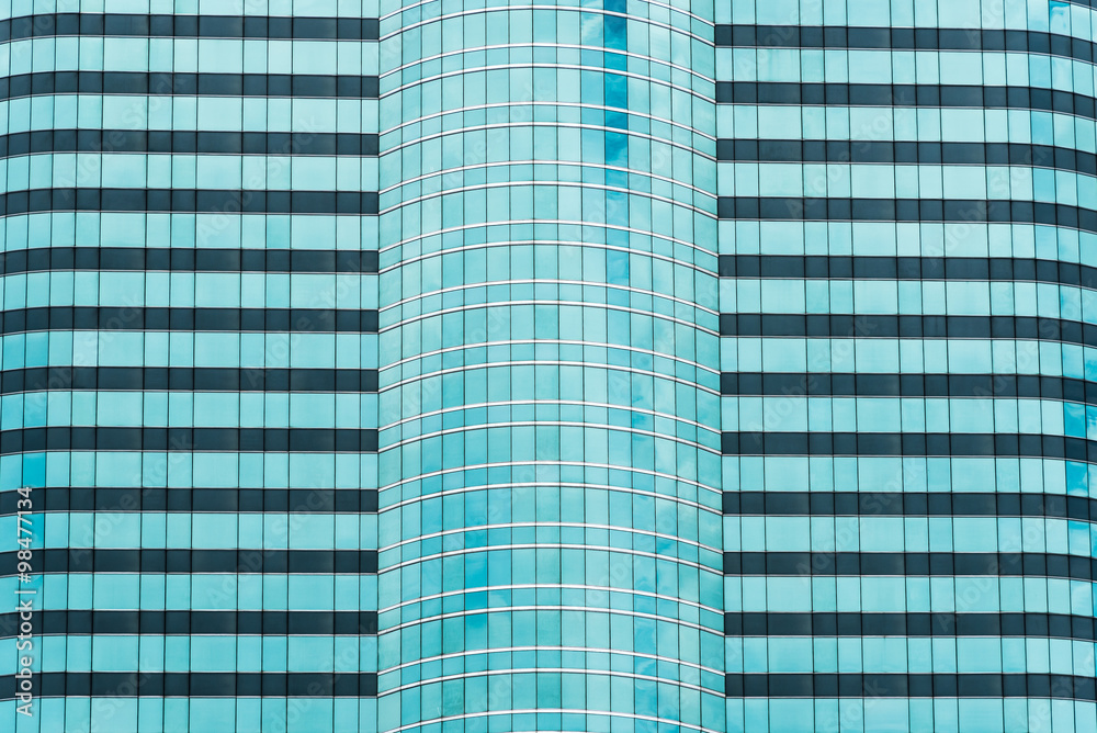 Modern Building Facade with Reflection of Clouds and Sky