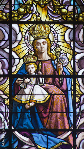 Malaga - Madonna with the child on the windowpane in the Cathedral.