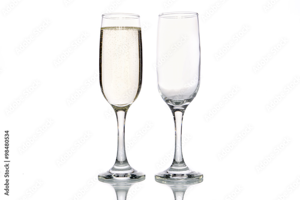 Glass of champagne and empty champagne glass Glass of champagne and empty champagne glass