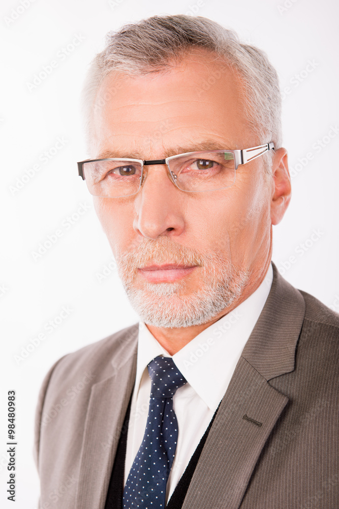 Portrait of old businessman in an elegant suit with glasses Portrait of old businessman in an elegant suit with glasses