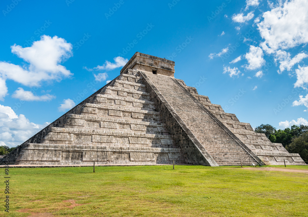 Famous mayan pyramid Chichen Itza in sunlight with nobody around in Mexico Famous mayan pyramid Chichen Itza in sunlight with nobody around in Mexico