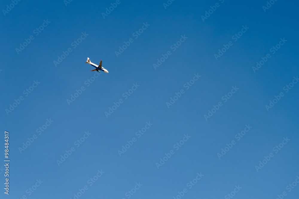 Airplane On Clear Blue Summer Sky