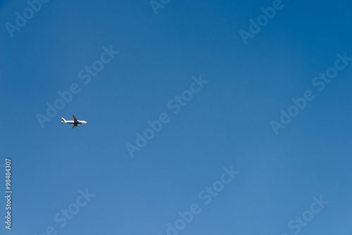 Airplane On Clear Blue Summer Sky