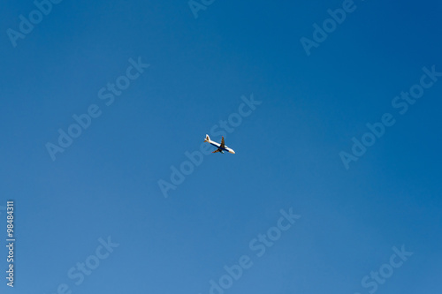 Airplane On Clear Blue Summer Sky