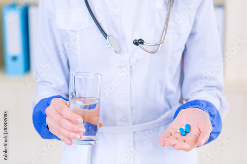 Professional nurse giving pills