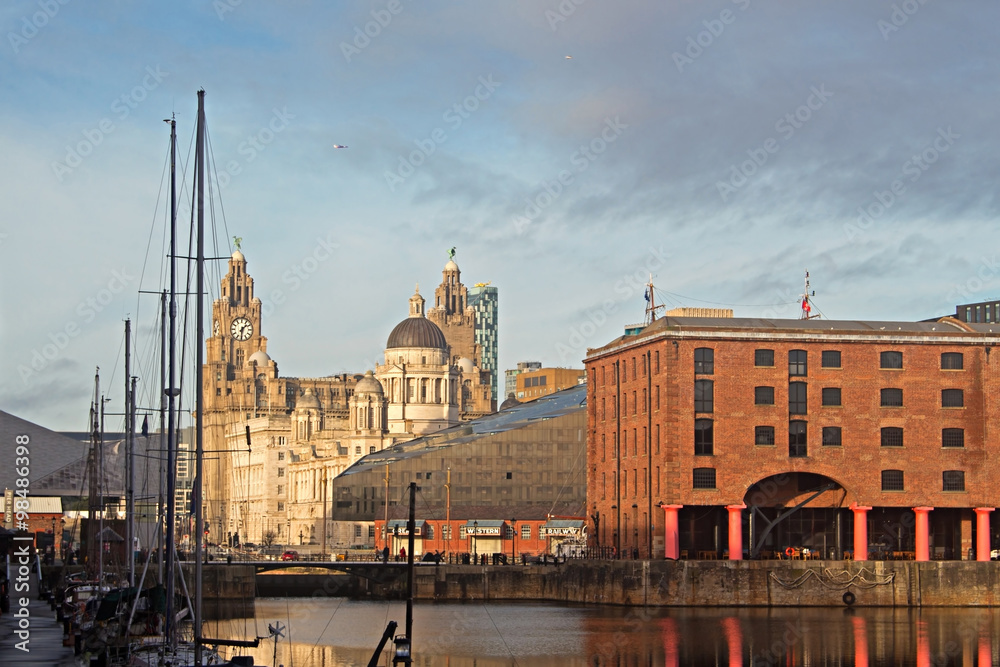 The Albert Dock and Liver Buildings in Liverpool UK on a beautif
