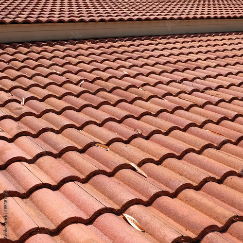 brown tile roof weathered on building residential