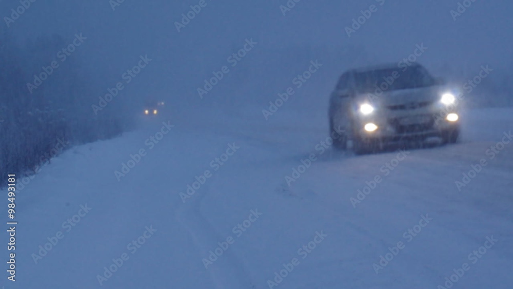 Winter snowfall. Traffic flow on highway Winter snowfall. Traffic flow on highway