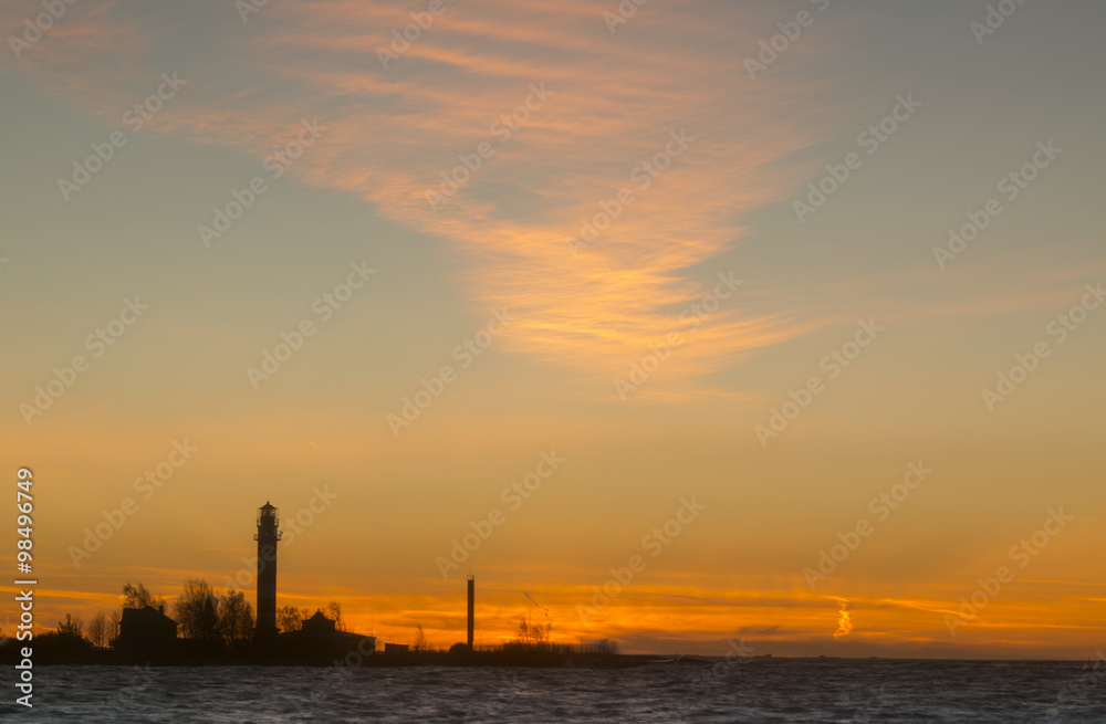 sunset at harbour with lighthouse
