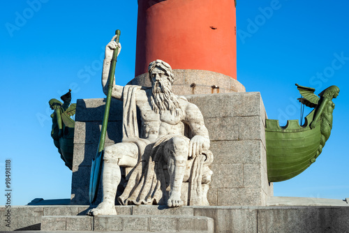 Rostral column with Neptune statue, St Petersburg, Russia photo