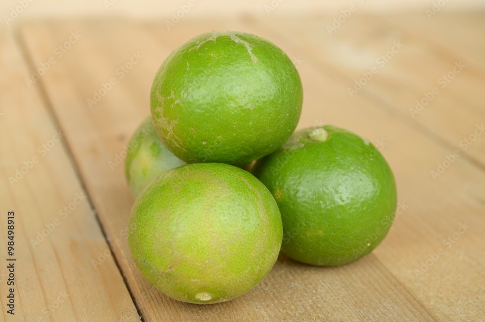 green lime on wood plank green lime on wood plank