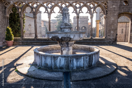 Balconata del Palazzo dei Papi di Viterbo con fontana quattrocentesca al centro della loggia  photo
