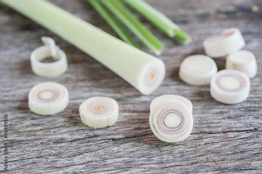 Fresh lemongrass slices on wooden background - Spice for health. Fresh lemongrass slices on wooden background - Spice for health.