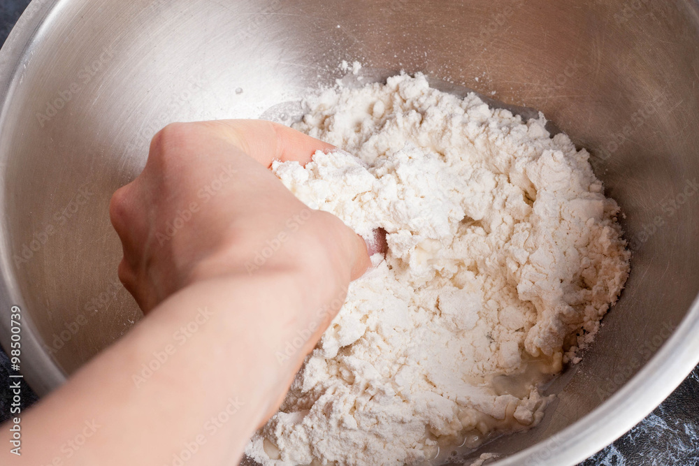 Making dough by female hands Making dough by female hands