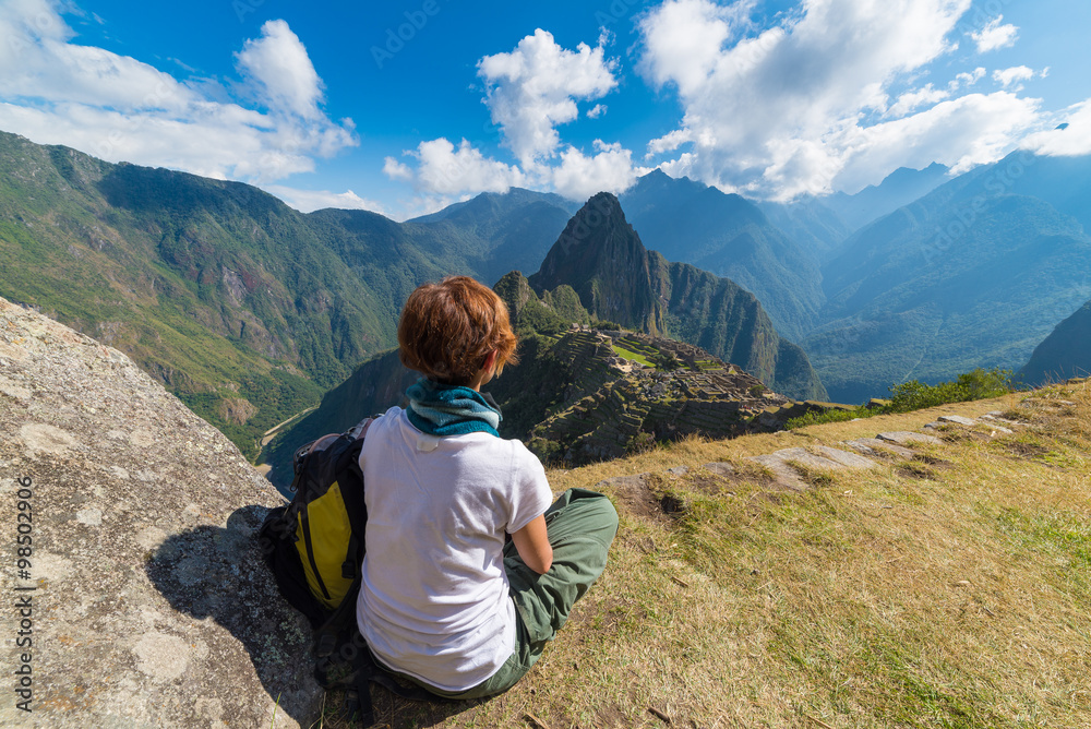 Tourist looking at Machu Picchu from above, Peru
