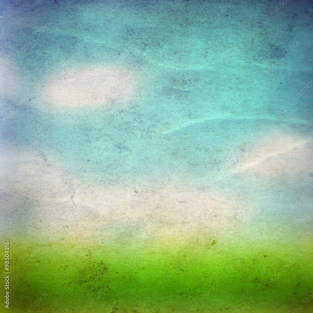 Conceptual green grass and sky old paper Conceptual green grass and sky old paper