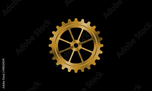 Golden gear on black background.
