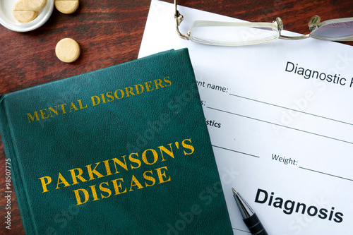 Parkinson's disease  concept. Diagnostic form and book on a table. photo