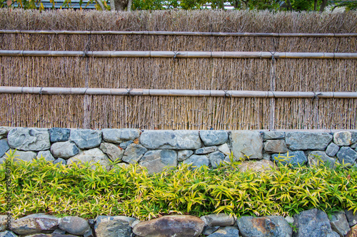 japanese stlye fence bamboo weaving and stone