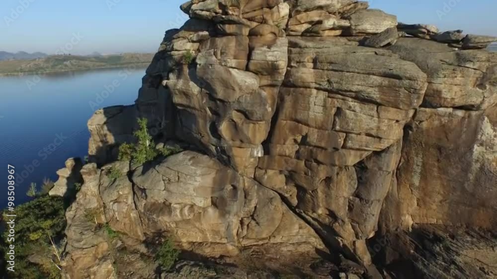 Warm lake surrounded by rocks in the Altai region. Warm lake surrounded by rocks in the Altai region.