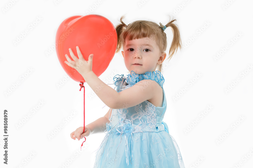 Little girl in blue dress holding a balloon Little girl in blue dress holding a balloon