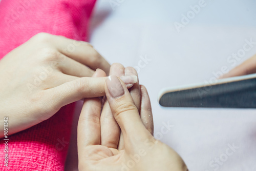 Manicure. Beauty saloon. Close-up. Remove old nail polish.