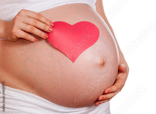 Wallpaper Mural Pregnant woman holding her hand on belly And holding a red heart Torontodigital.ca