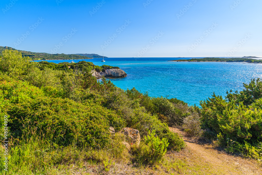 Coastal path and view of beautiful sea lagoon with turquoise water near Grande Sperone bay, Corsica island, France