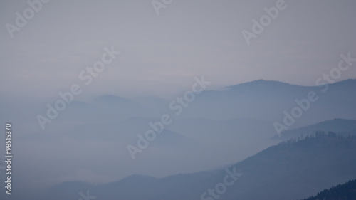 hills sticking out of thick fog © catgrig