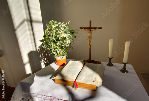 Fotografia, Obraz HDR shot of altar with cross and bible in a church building in Rassdorf, Hesse,
