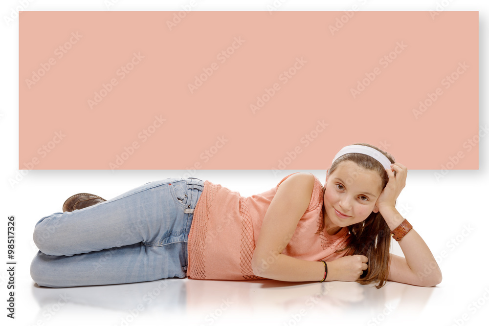 portrait of smiling little girl lying on the floor isolated on w Stock ...
