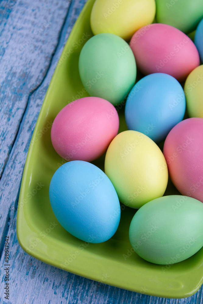 Easter eggs on a green plate Easter eggs on a green plate
