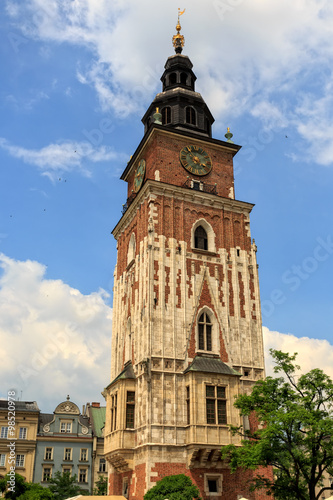 City Hall tower against blue sky on main market square of Krakow