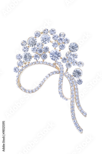 Fotografía gold brooch with diamonds isolated on white