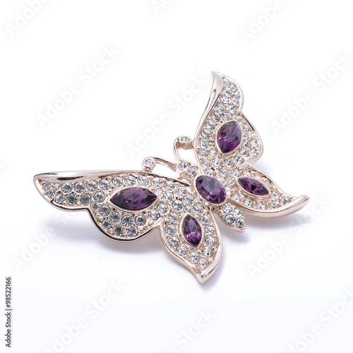 brooch in the shape of a butterfly on a white background